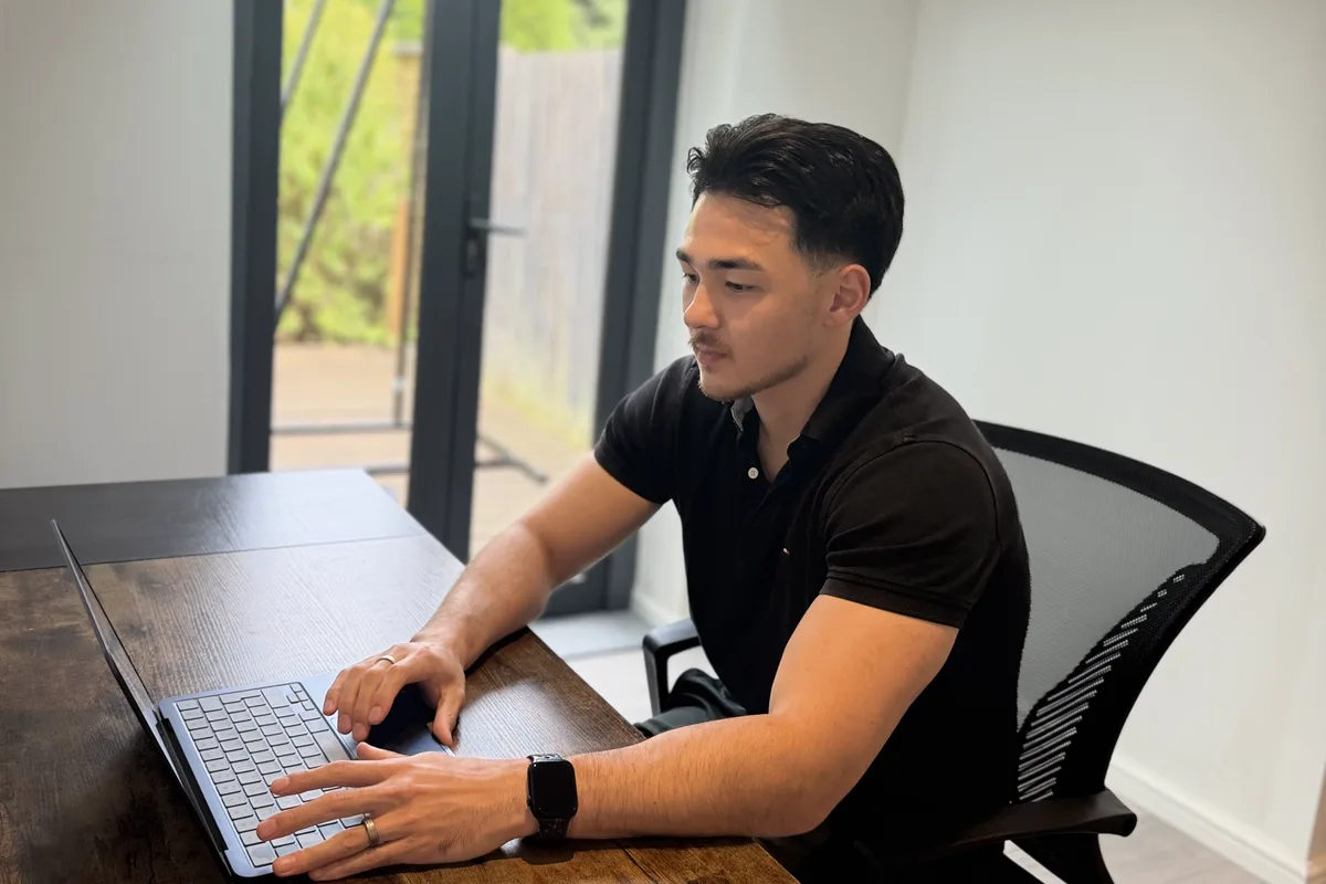 Jordon planning a client project at his desk